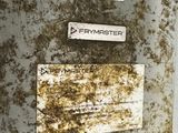 a metal box with a sign on it that says frymaster