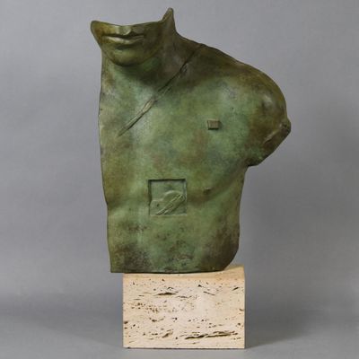 a bronze busturine of a man with a hat on his head