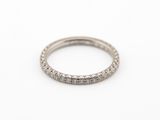 a white gold wedding band with round brilliant cut diamonds