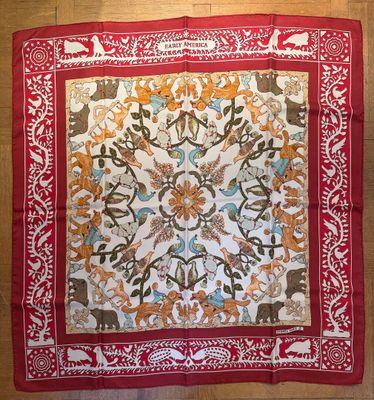 an image of a red and white banda with animals on it