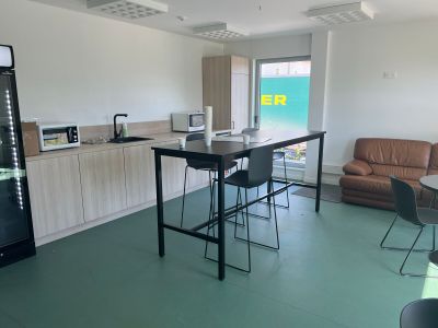 a kitchen with a table and chairs in it
