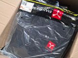 a box of clothing that is sitting on the floor