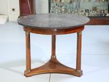 a small table with a marble top on a white floor