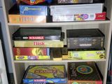 many board games on the shelves in the room