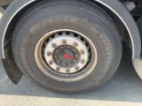 a close up of a flat tire on a truck