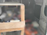 a white van with a small table in the back of it