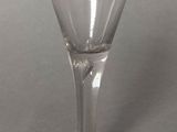 a wine glass that is sitting on a table