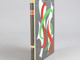 a book with a red, green, and white design on it