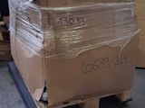a large cardboard box on a pallet in a warehouse