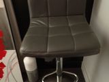 grey leather bar stool with chrome base and foot rest