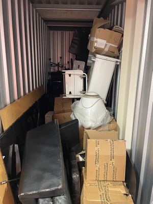 many boxes in the back of a moving truck