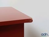 a cat that is sitting on top of a desk