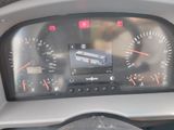 a picture of a car dashboard with a clock on it