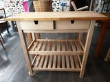 a wooden table with a basket on top of it