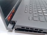 a close up of a laptop with a red sticker on it