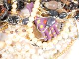 many different types of jewelry on the table