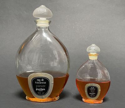 two bottles of liquor sitting next to each other on a table
