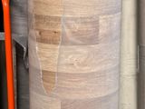 many rolls of paper on the shelf in the warehouse