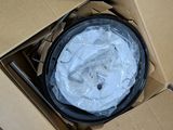 a cardboard box that has a black and white clock inside of it