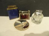 a small glass jar and a small glass jar on a table