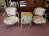 two chairs that are sitting next to a table