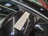 a sticker on the side mirror of a car