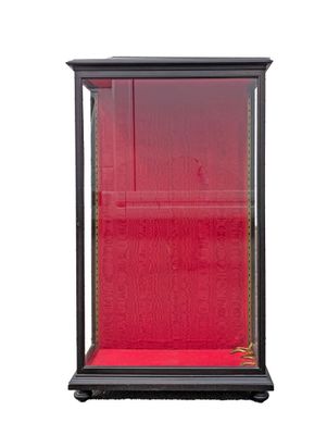 an image of a display case with a red cloth on it