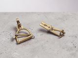 a pair of gold earrings with a small triangle and a small triangle
