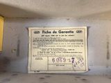 a sign on the side of a microwave that reads friche de garantite