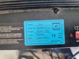 a close up of a blue label on a black motorcycle