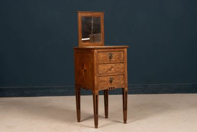 an old wooden dresser with a mirror on top of it