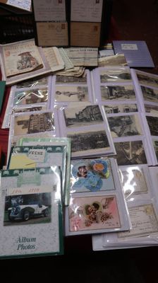 a table with many different types of postcards on it