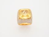 a yellow sapphire and diamond ring