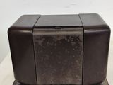 a close up of a toaster on a table with a white background
