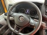 dashboard of a car with a steering wheel and gauges