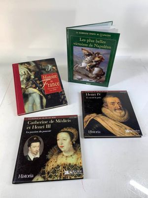 four books on a white table with a white background