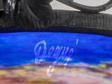 a picture of a close up of a plate with a bird on it