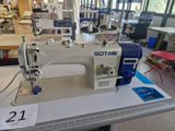 a sewing machine that is sitting on a table