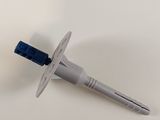 a close up of a toothbrush and a tube of toothpaste on a table