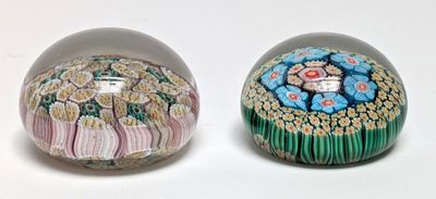 two eggs that have been decorated with flowers on them