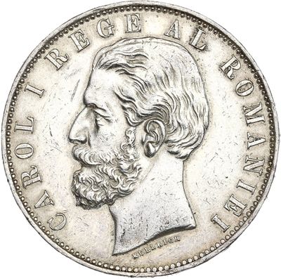 Gros plan sur une pièce de monnaie portant le visage d'un homme