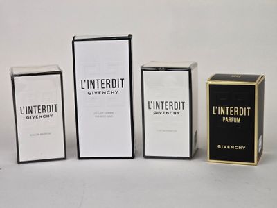 three boxes of different types of perfume sitting next to each other