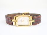 an image of a wrist watch with a brown leather band