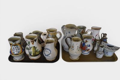 many different types of vases sitting on a tray