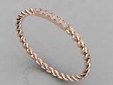 a rose gold wedding band with diamonds on top