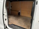 a white van with the door open and the back door open