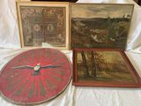 three framed paintings and a clock on a bed with a white sheet