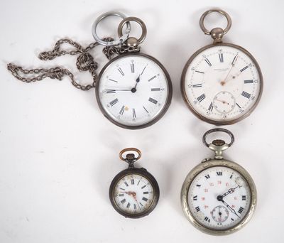 three different types of pocket watches are displayed on a white surface