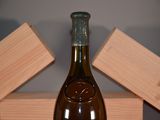 a bottle of wine that is sitting on a table