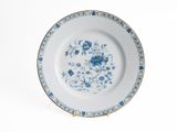 a blue and white plate with blue flowers on it